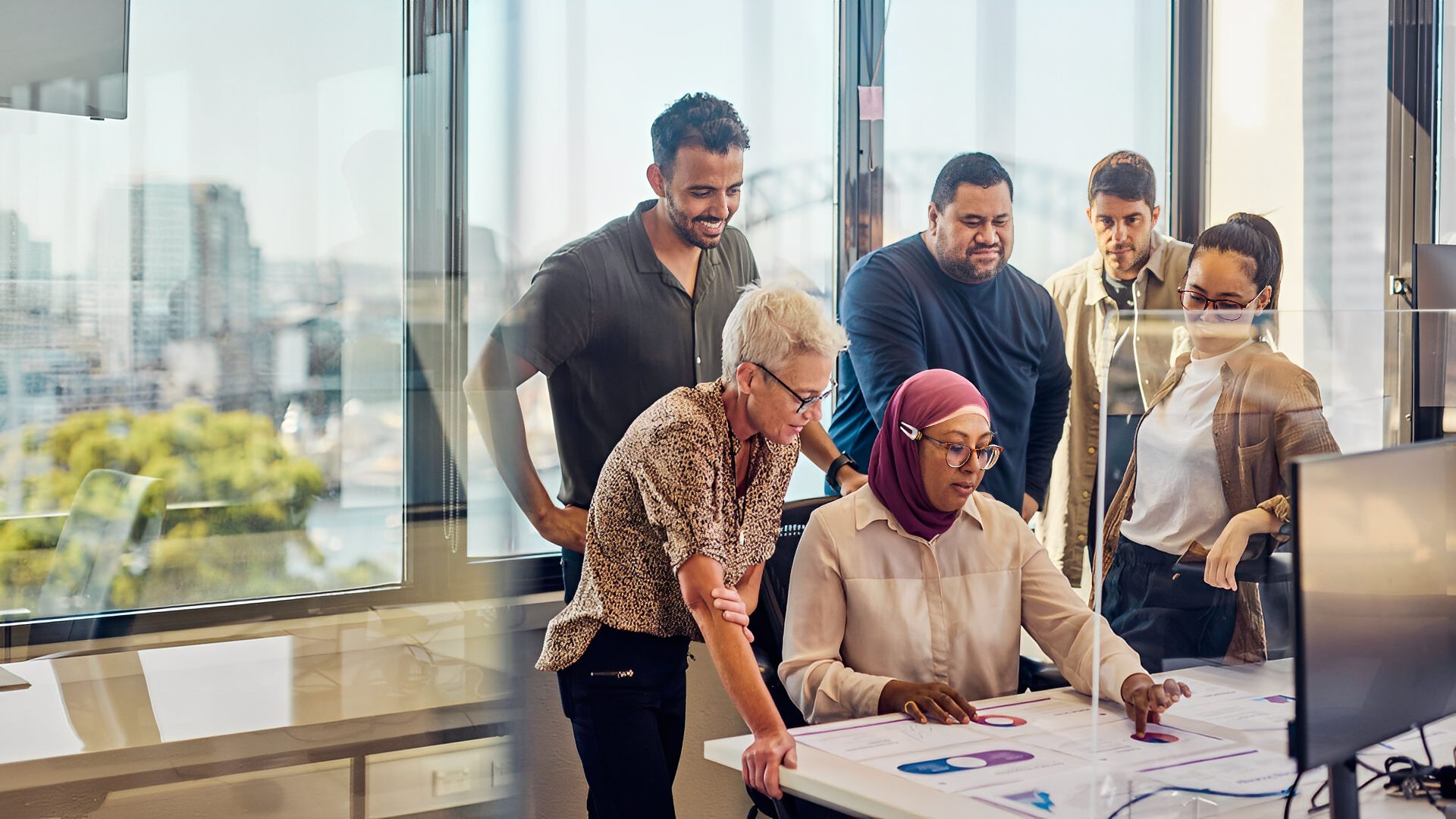 Team collaborating in modern office setting.
