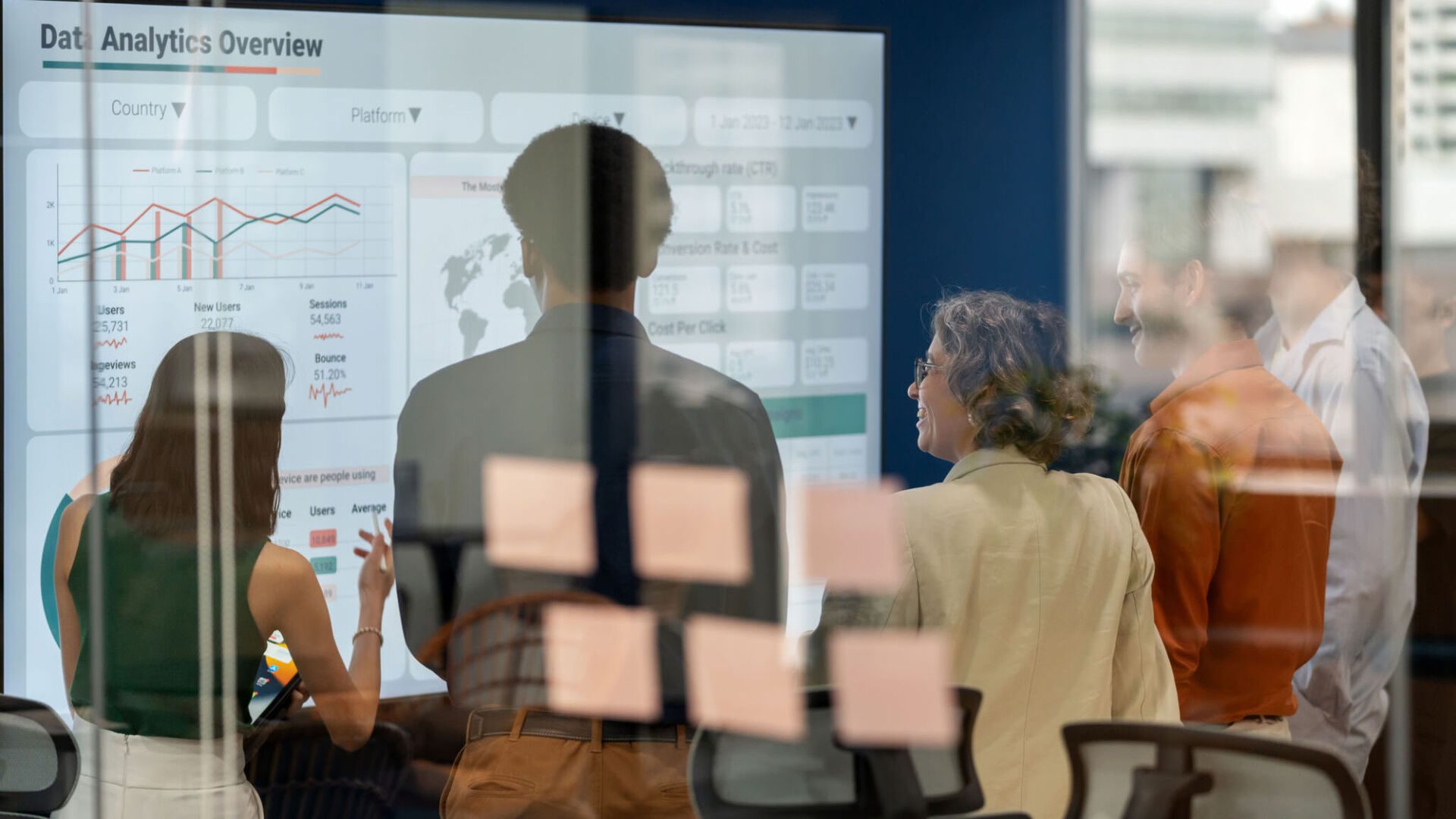 People discussing data analytics on screen.